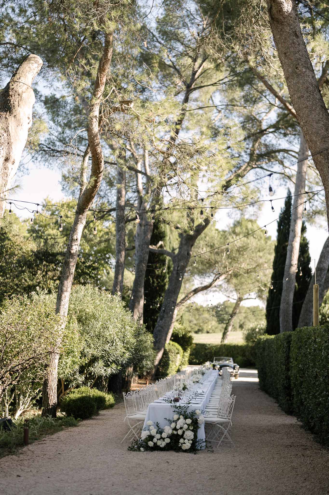 Wedding reception table setting in a garden with peonies