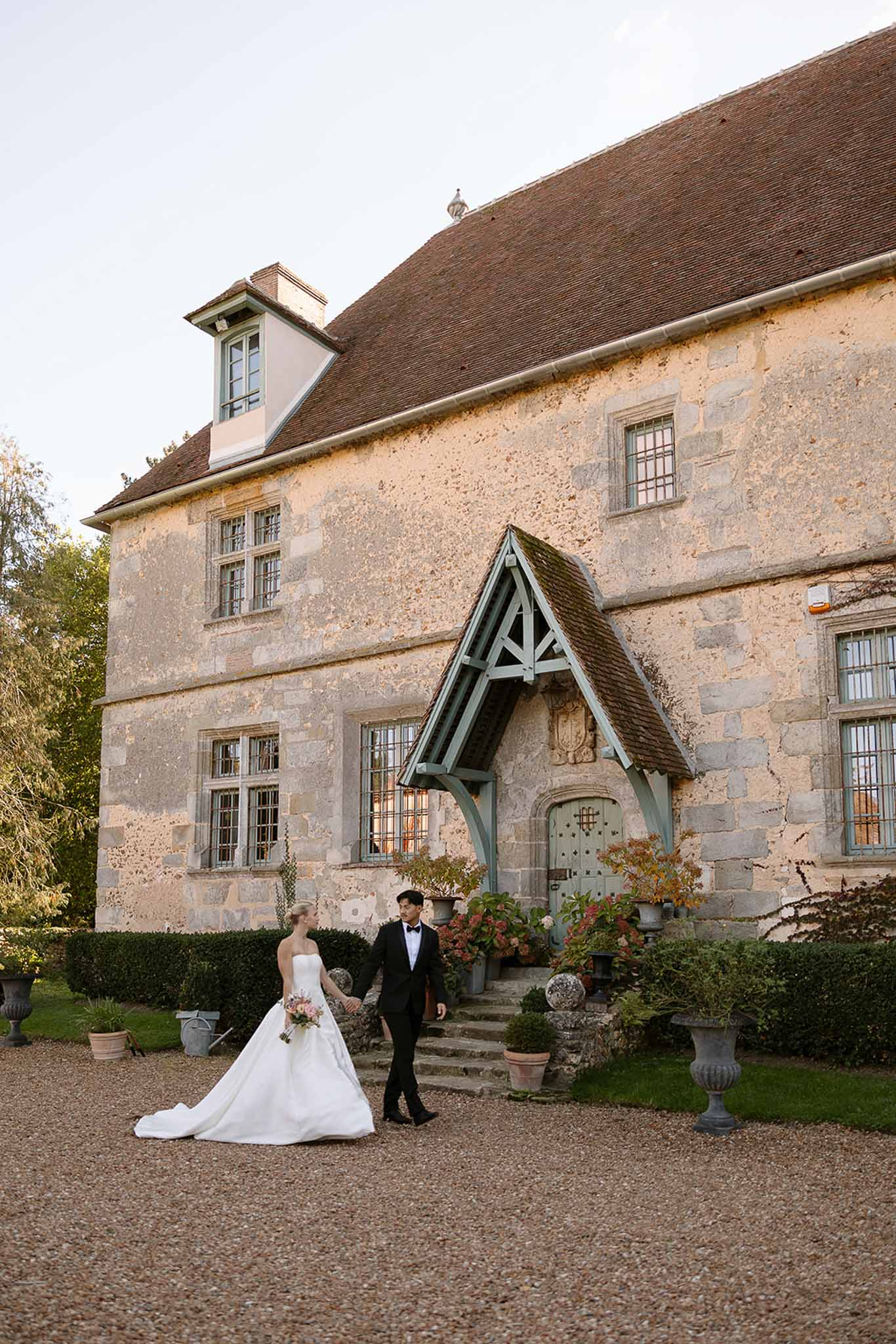 Bride and groom walking hand in hand