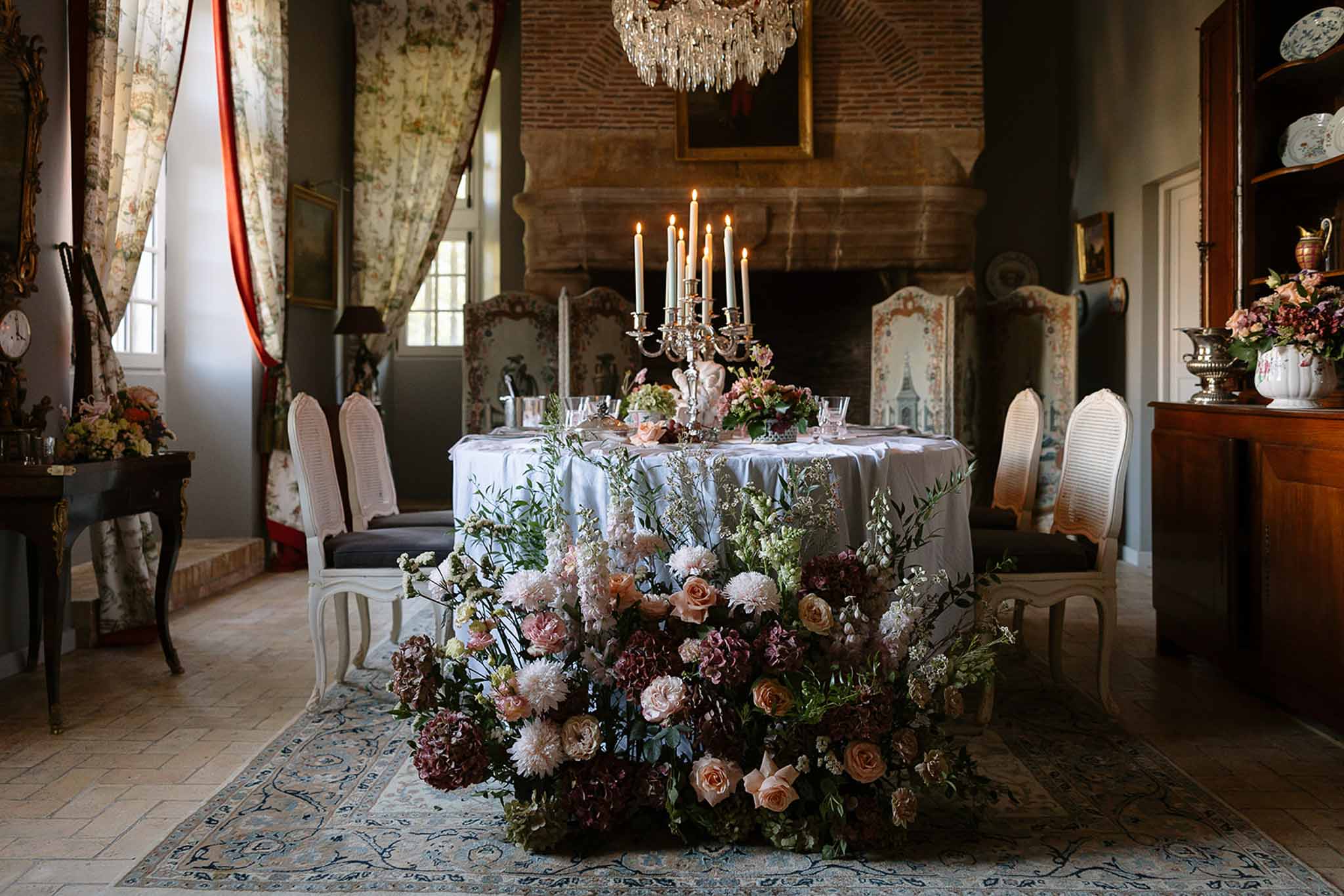 Wedding reception table setting in a garden with white roses