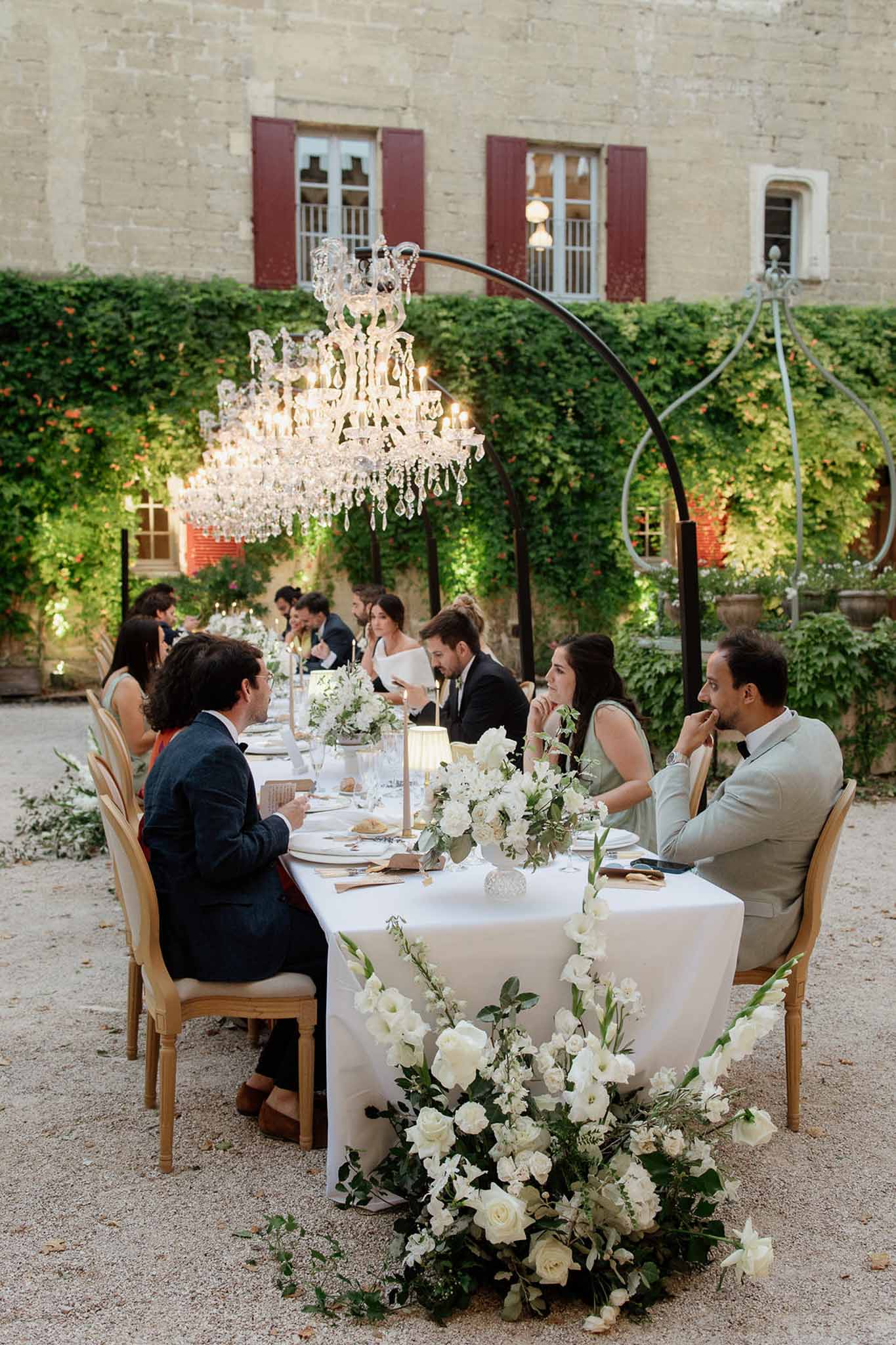 Wedding reception table setting with white roses
