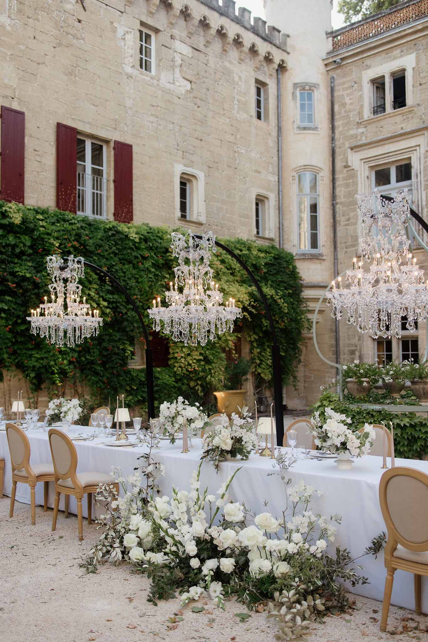 Wedding reception table setting with white roses