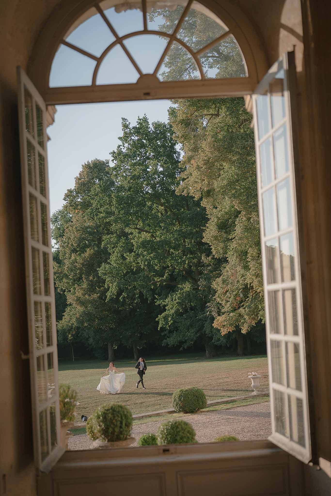 Bride and groom walking hand in hand