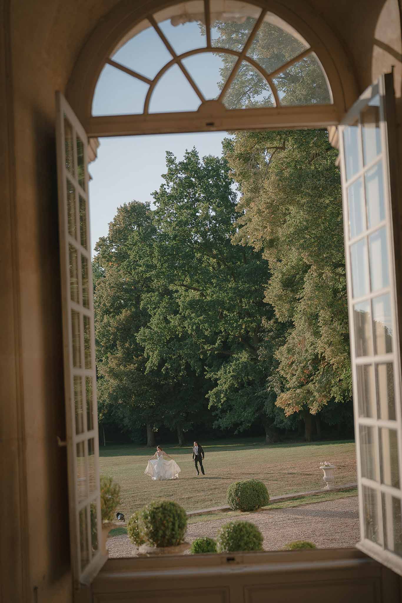 Bride and groom walking hand in hand
