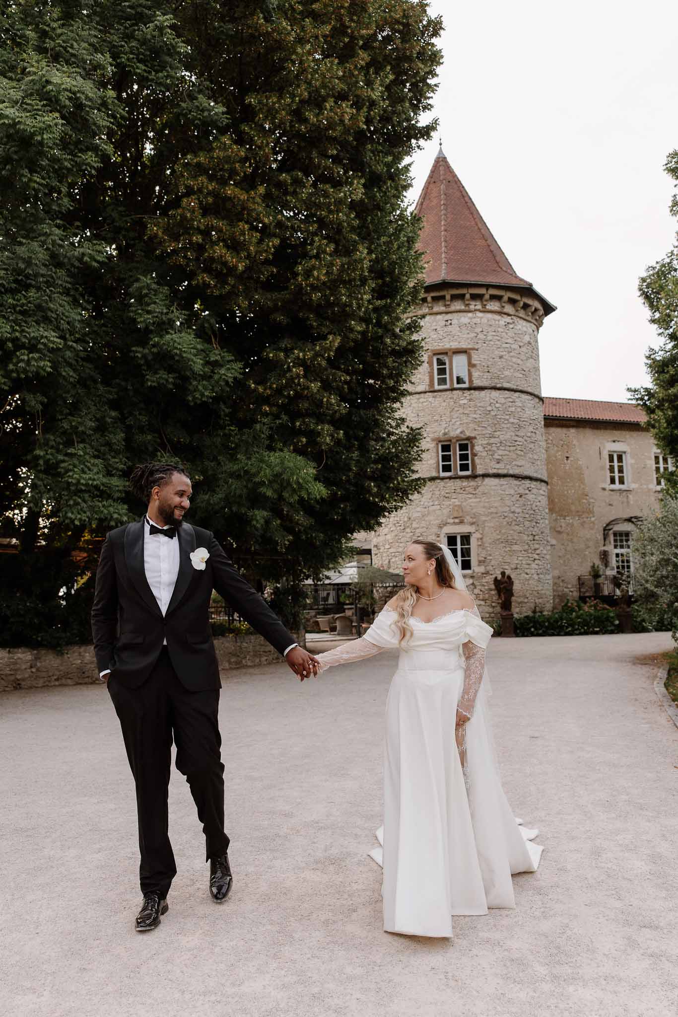 Bride and groom walking hand in hand