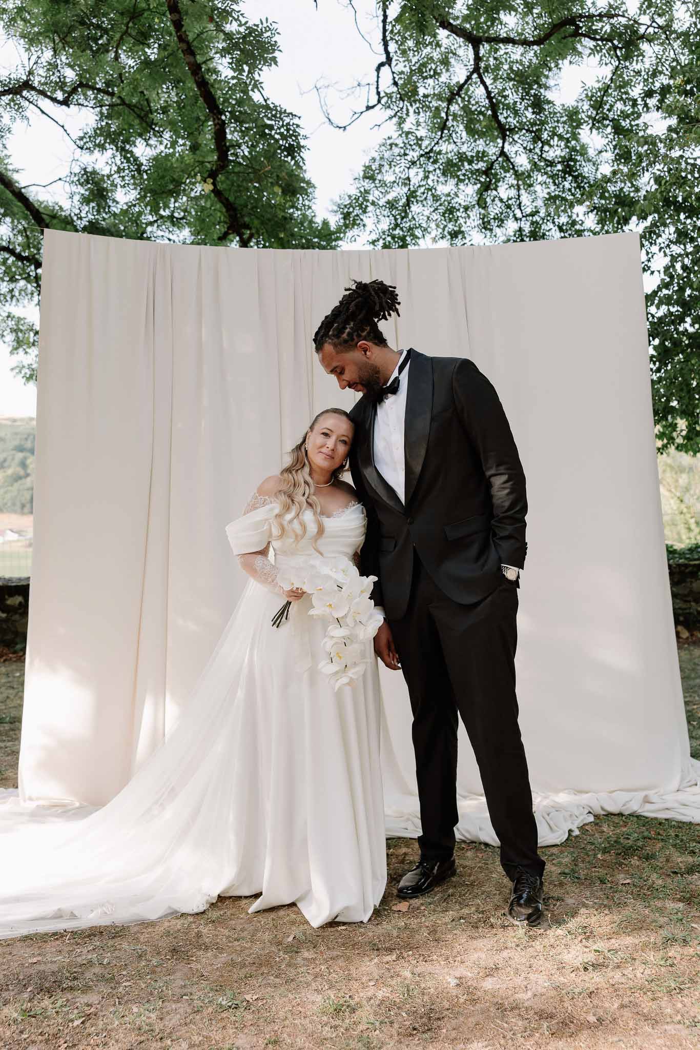 Bride and groom portrait in a garden