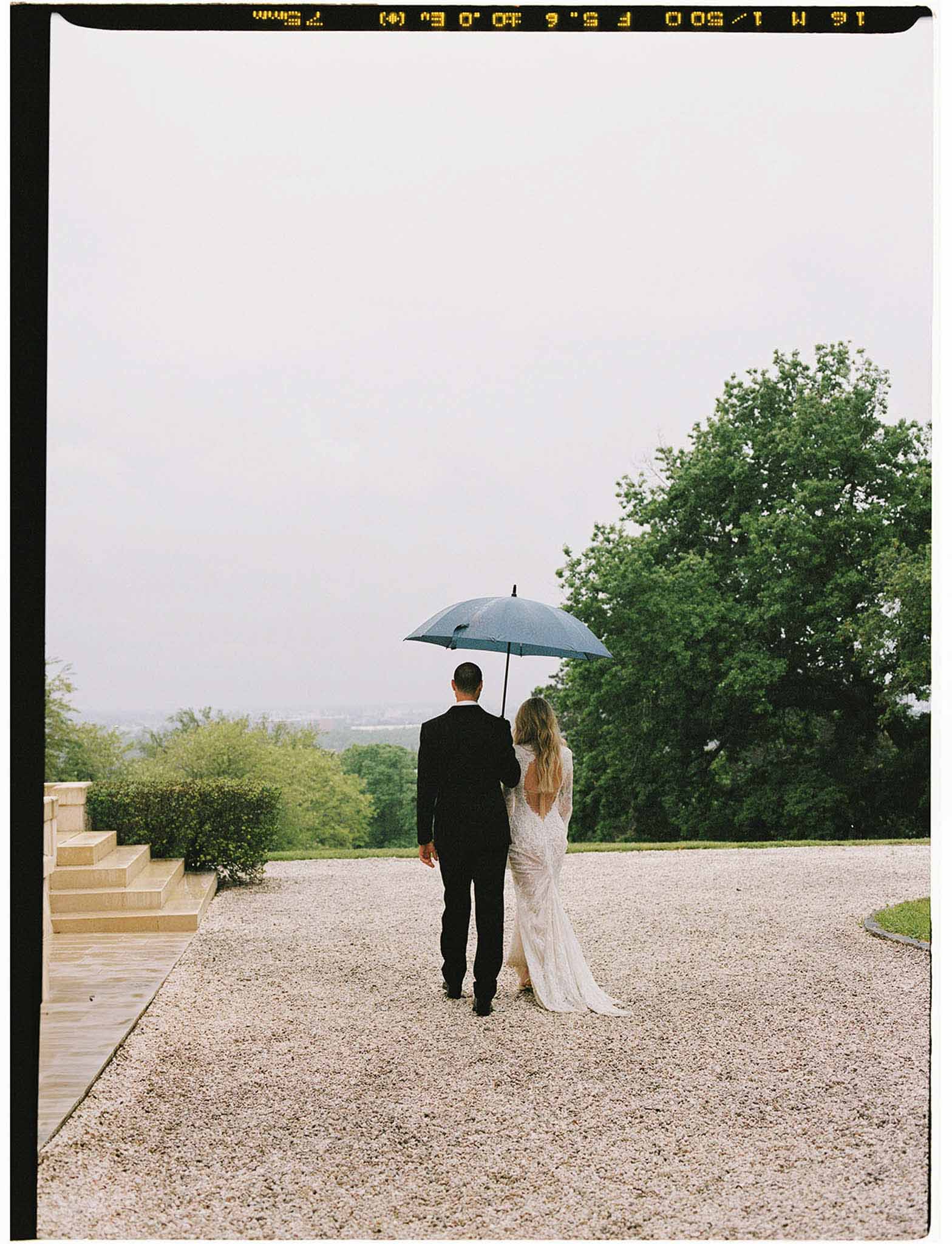 Bride and groom walking hand in hand