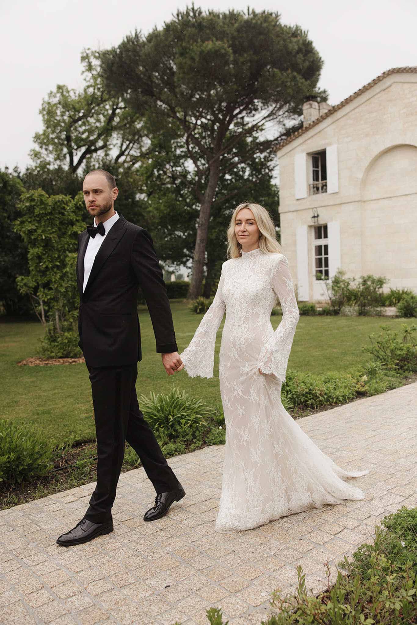 Bride and groom walking hand in hand