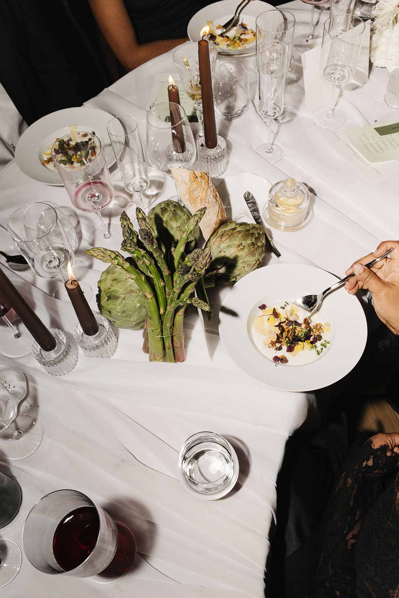 Wedding reception table setting with white roses