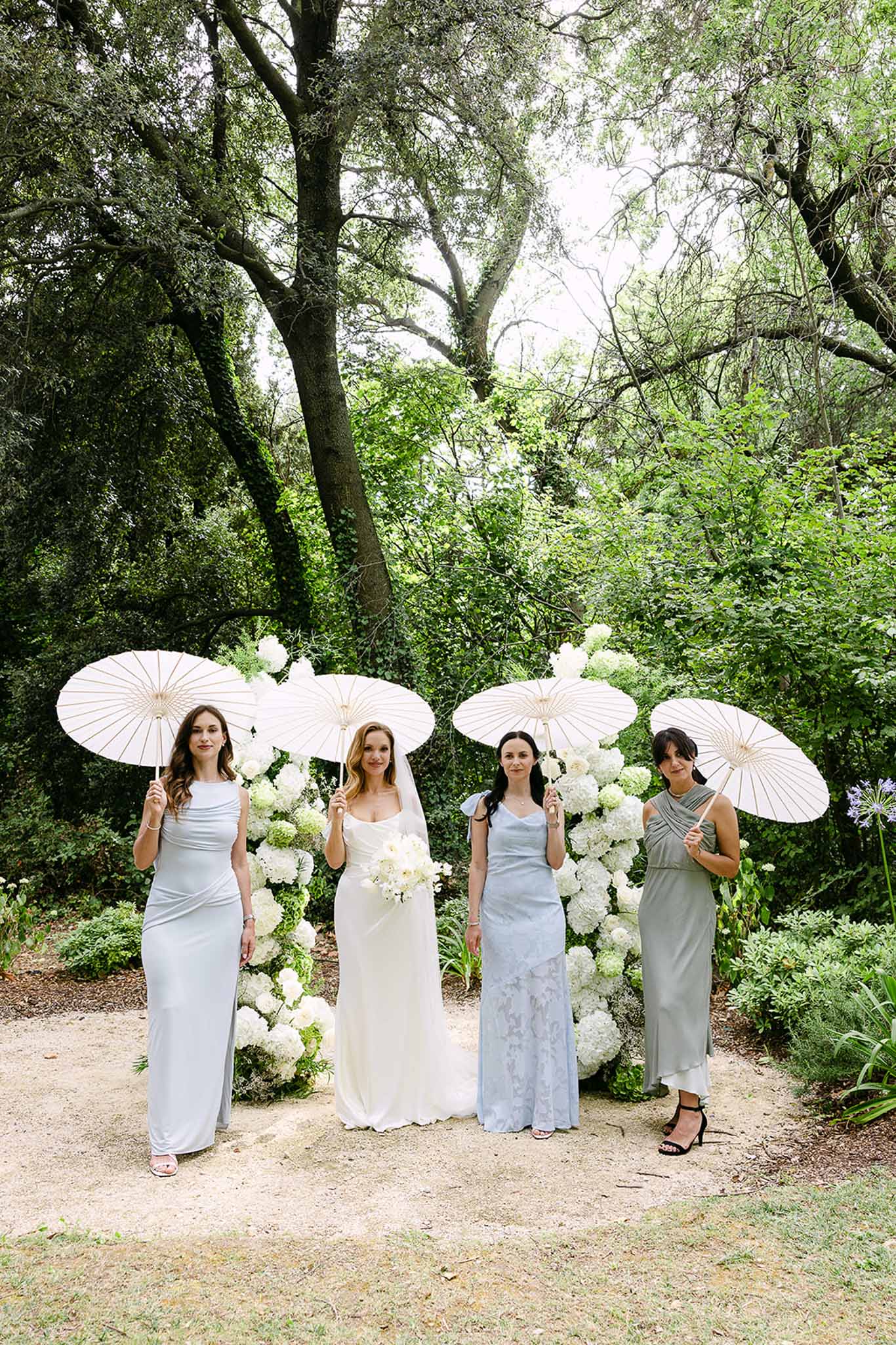 Bride and bridesmaids at ceremony altar