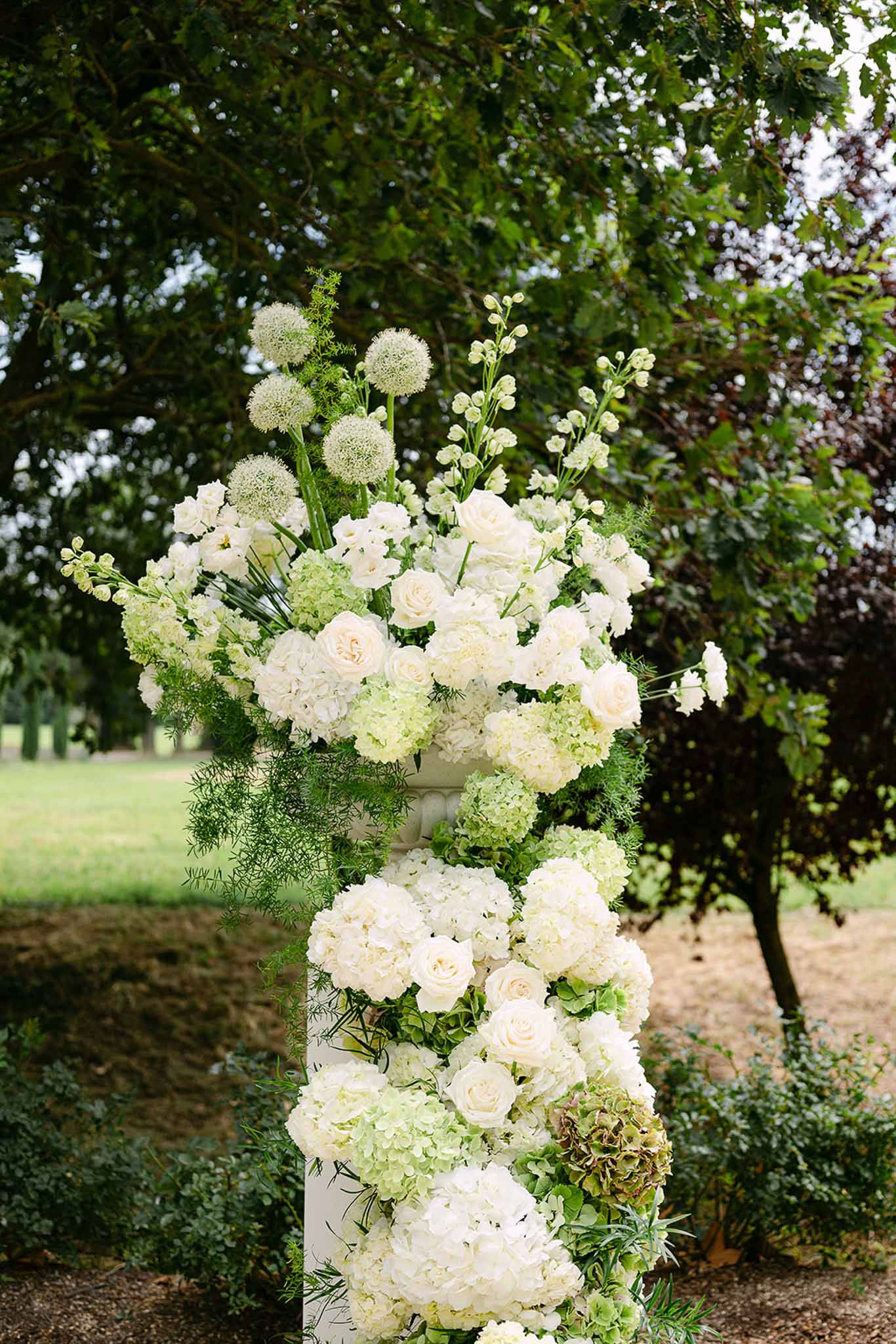 Wedding ceremony in a garden with white roses
