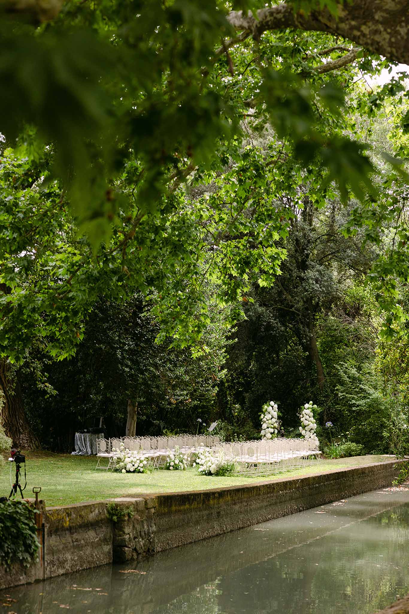 Wedding ceremony setup in a garden with white roses