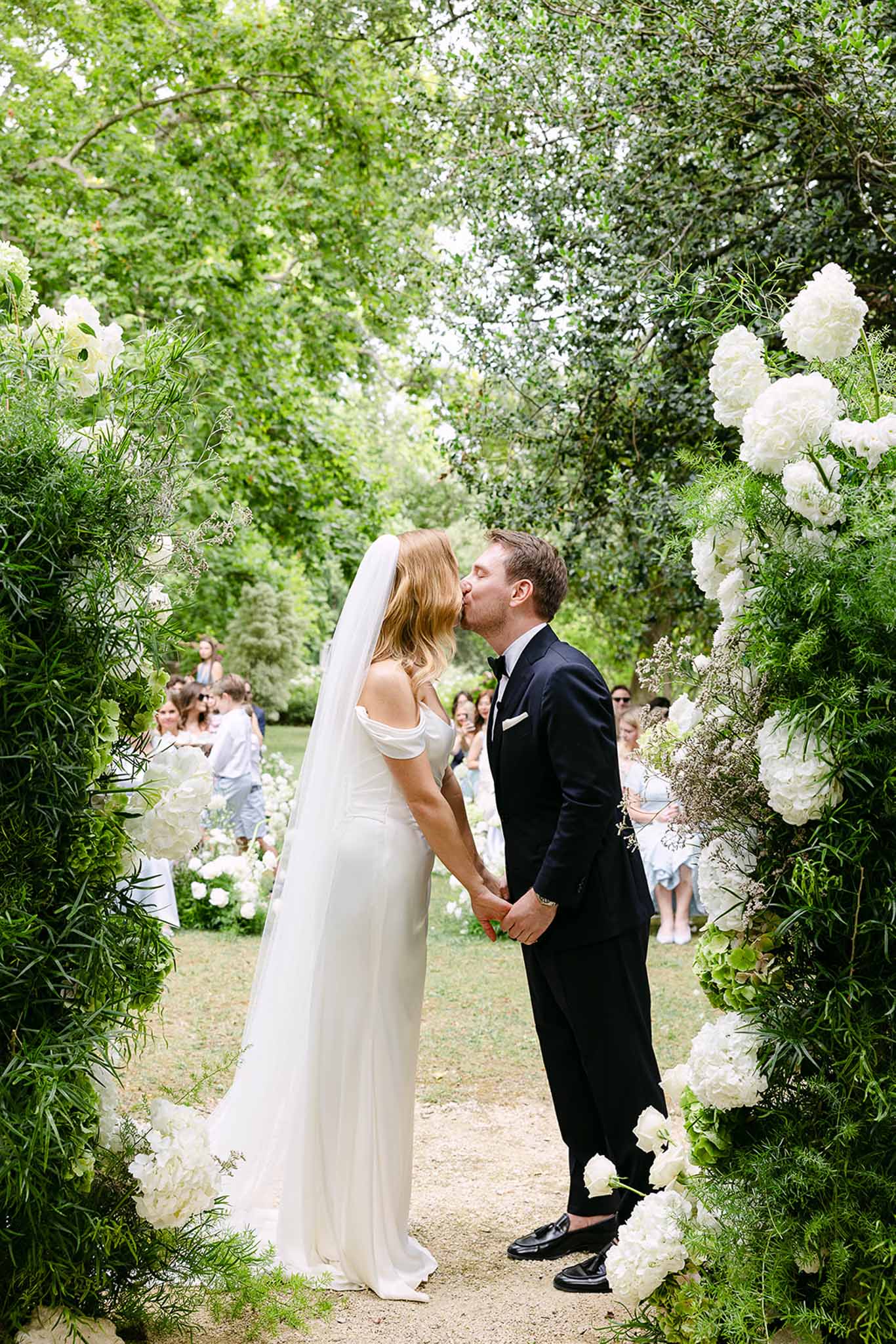 Wedding ceremony in a garden with white roses