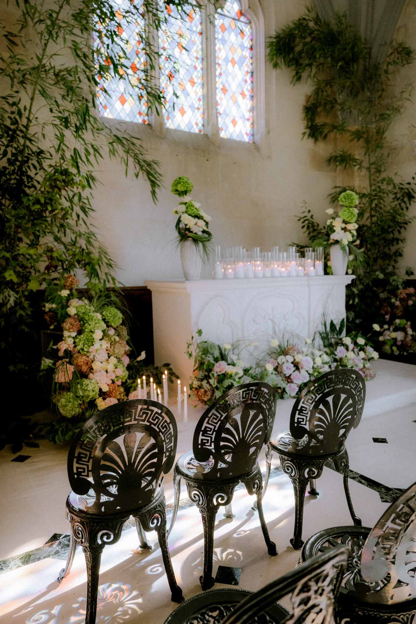 Wedding ceremony setup in a chapel with hydrangeas