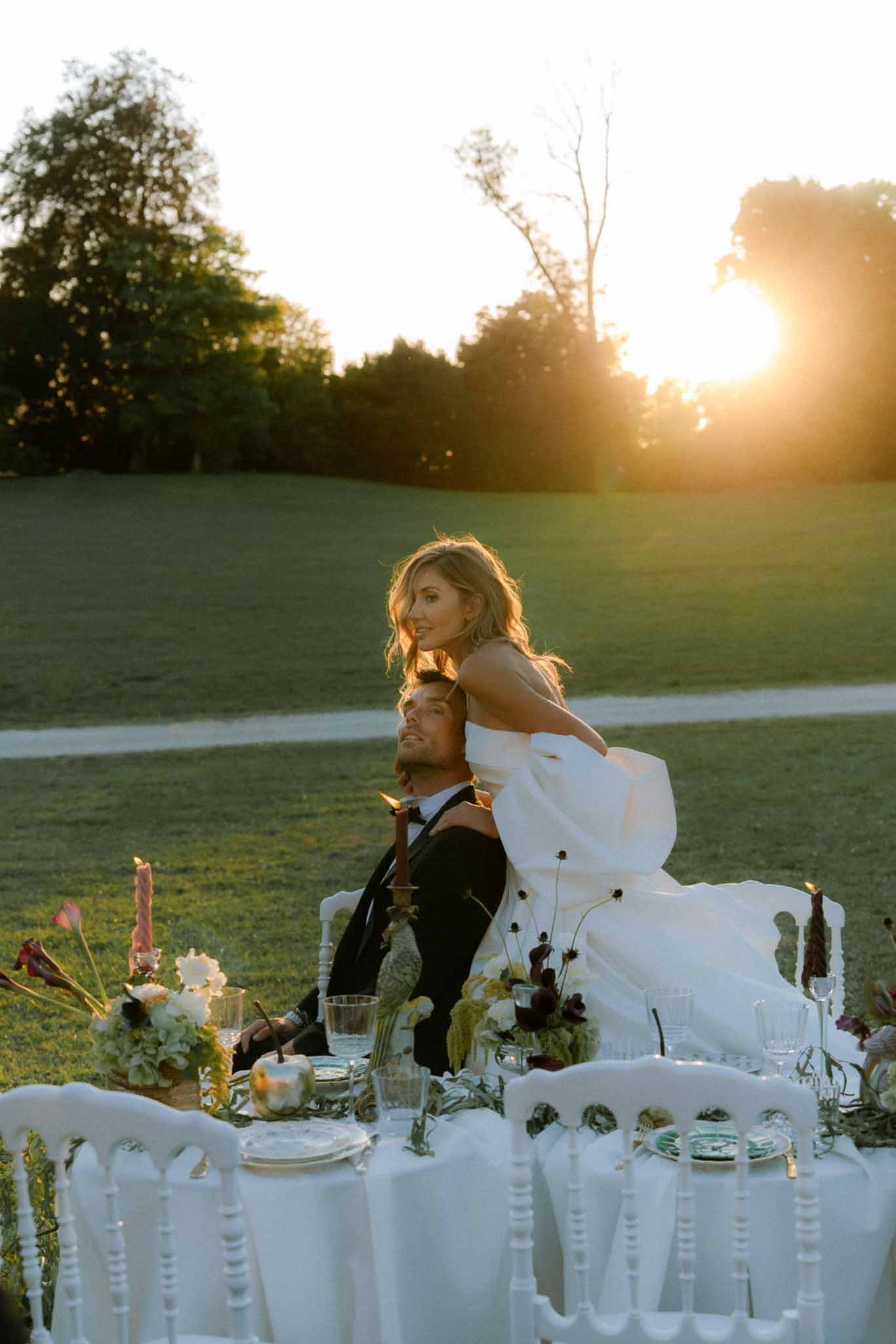 Wedding reception table setting with white roses