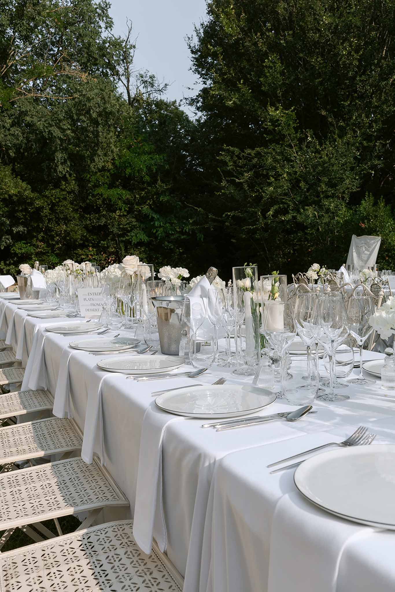Wedding reception table setting with white roses