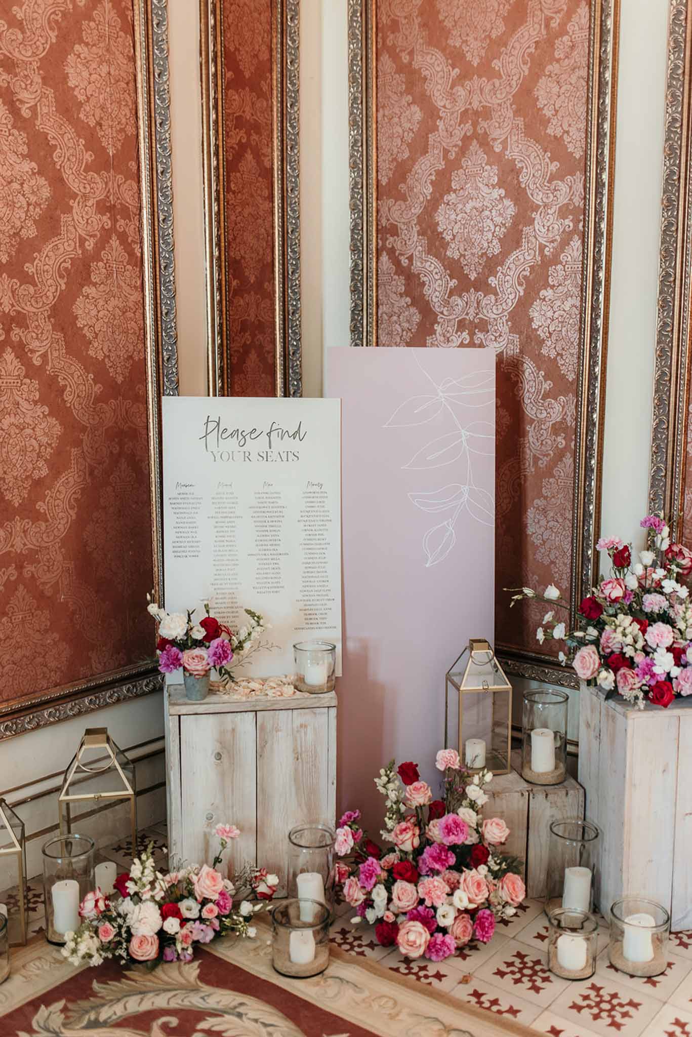 Wedding rings in a garden with white roses