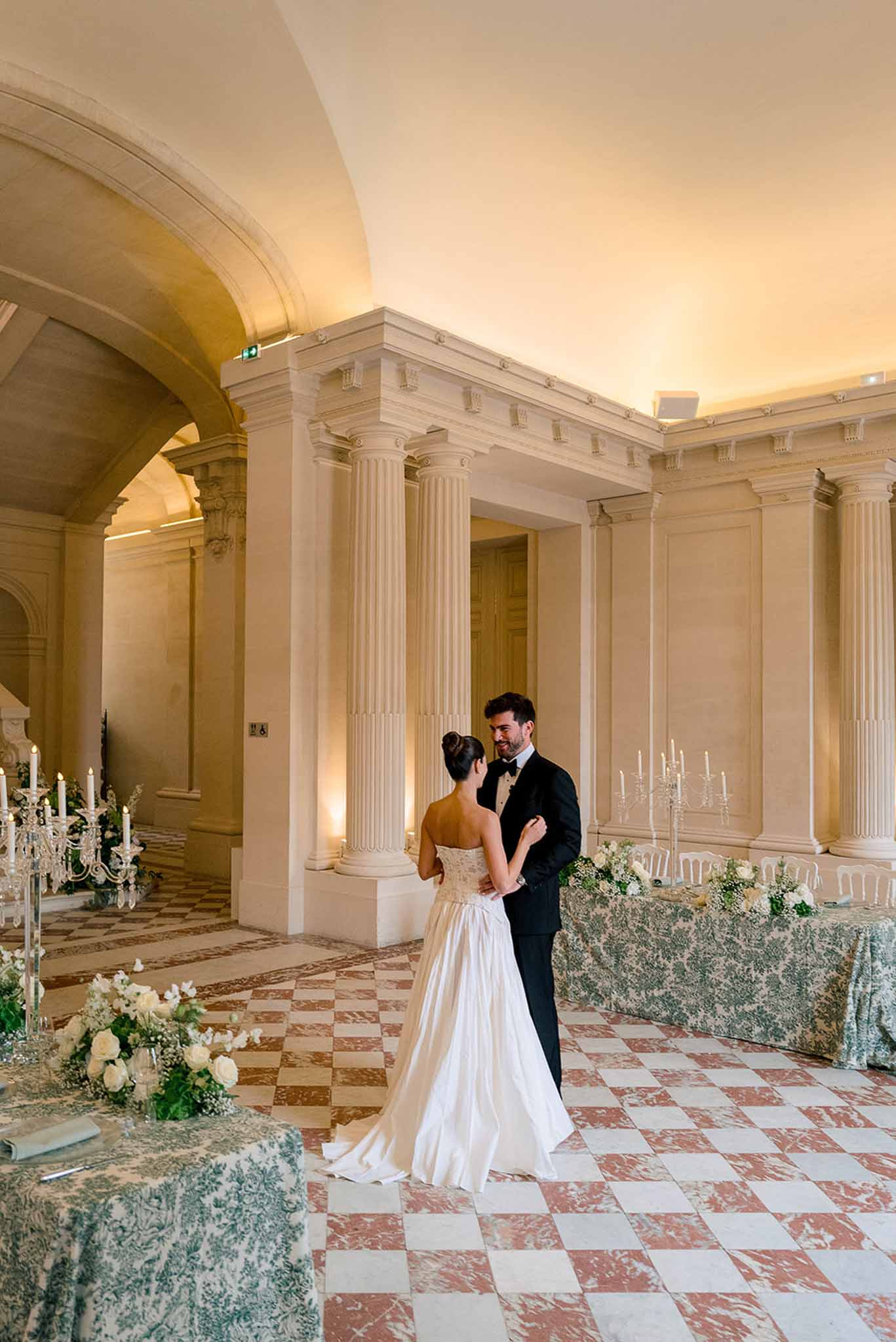 Wedding reception table setting with white roses