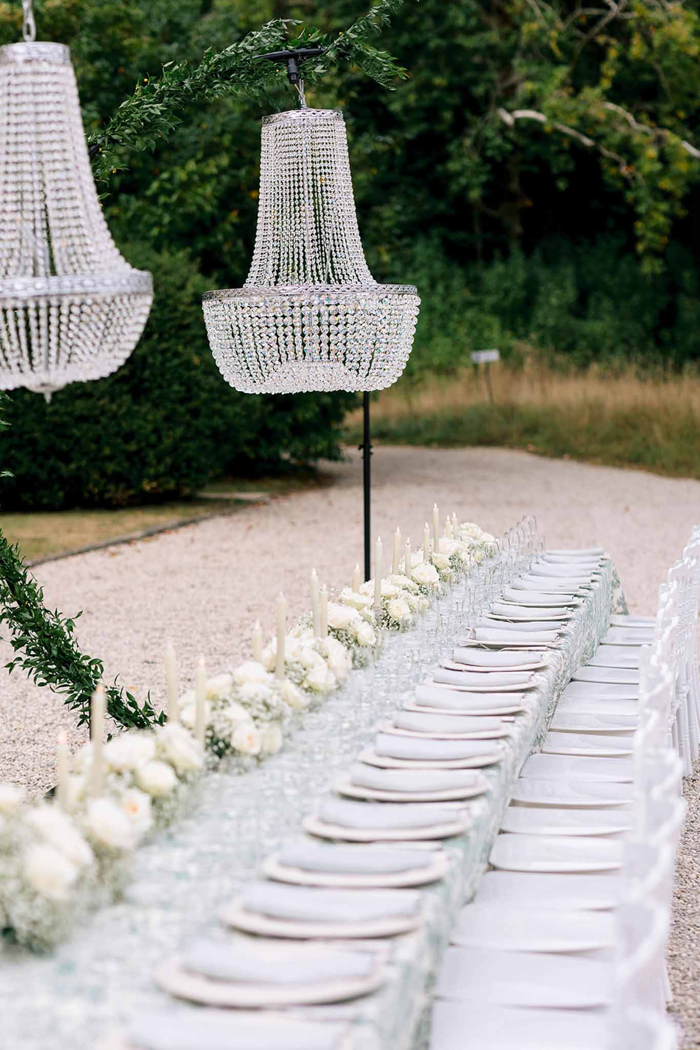 Wedding reception table setting with white roses