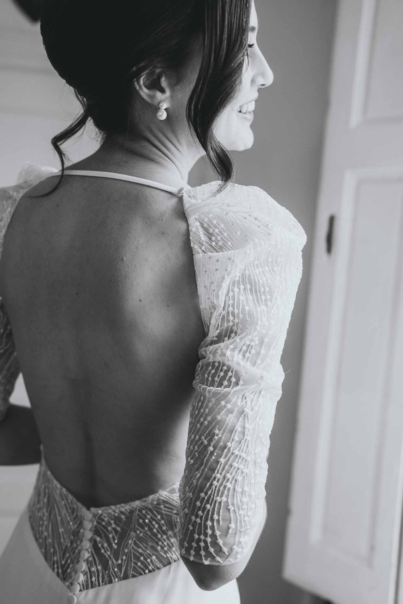 Full view of bride's sparkly open-back wedding dress