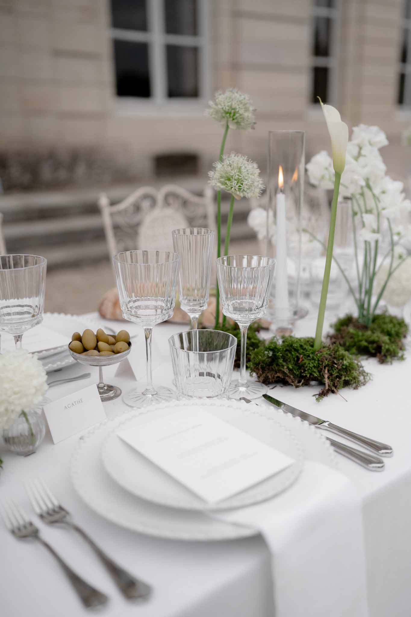 Table setting with floral centerpiece and minimalist menu card