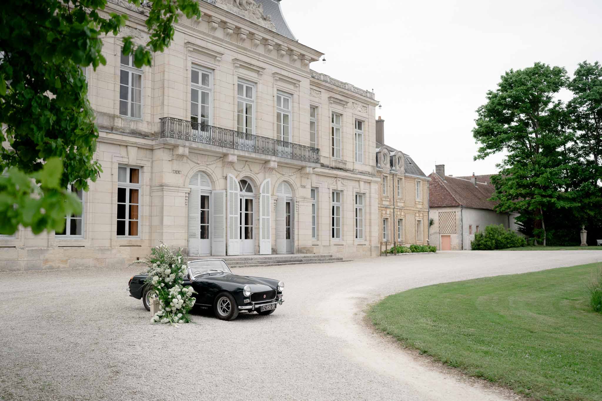 Aerial view of black vintage car decorated with flowers