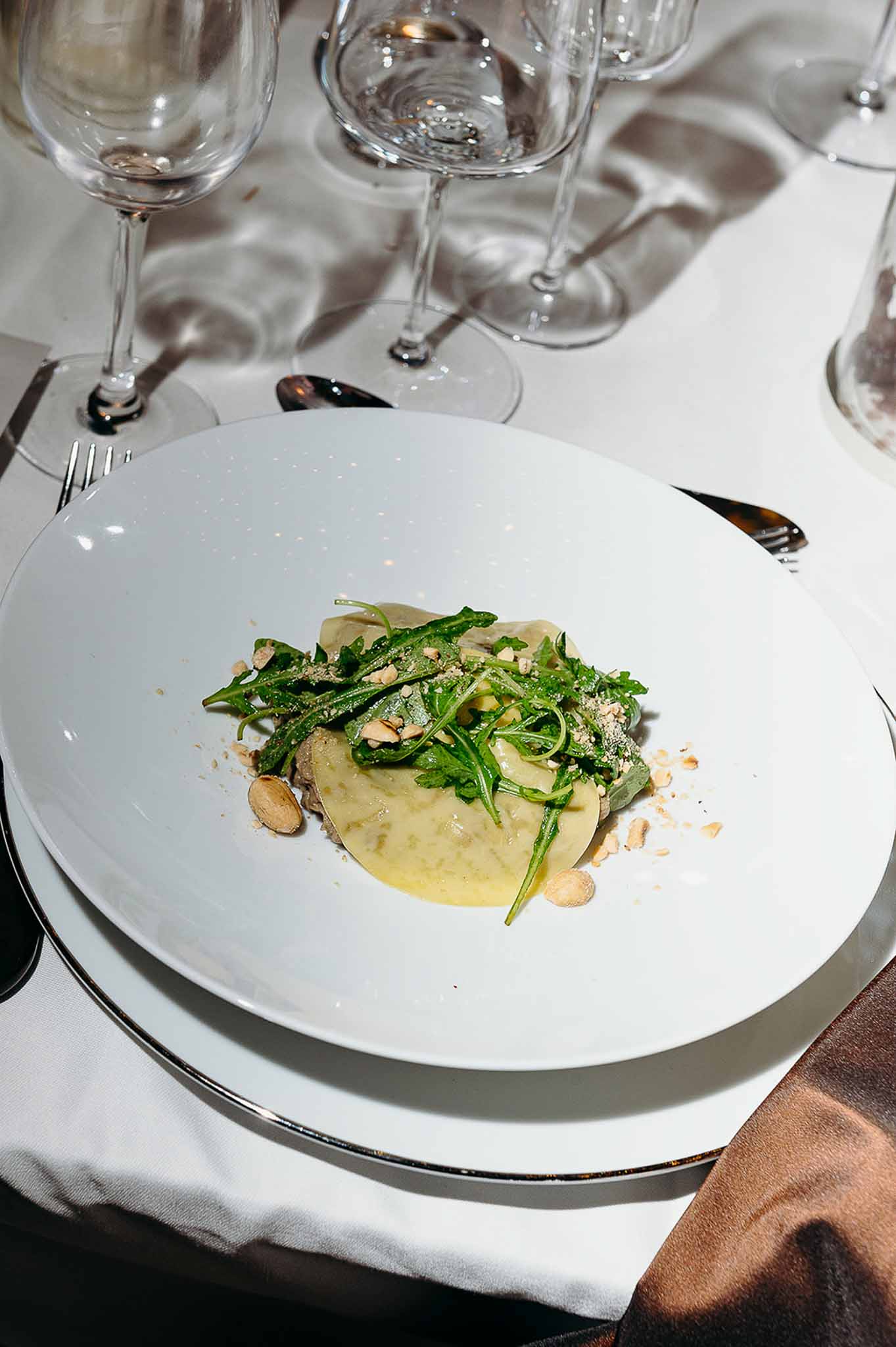 Reception dinner guests being served their plates at Domaine de Perrotin