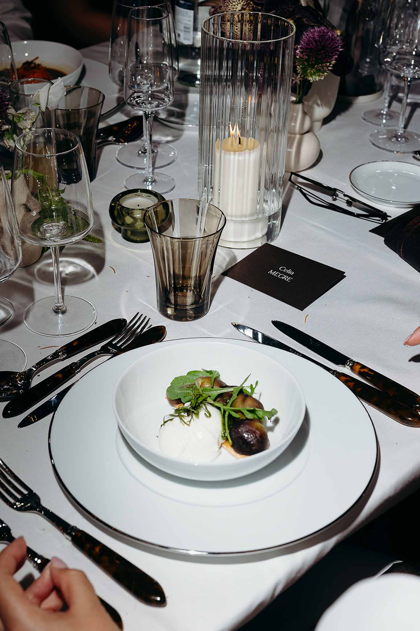Reception dinner guests being served at the table at Domaine de Perrotin