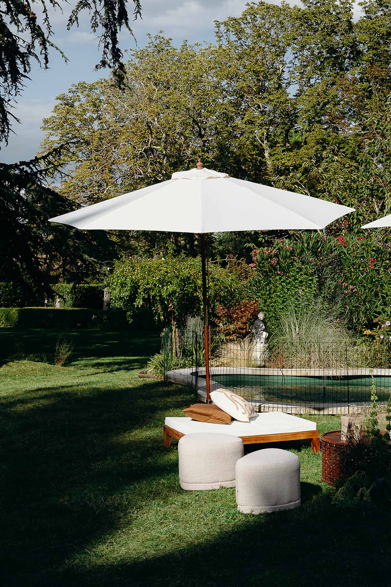 Pool area and lounge during golden hour at Domaine de Perrotin