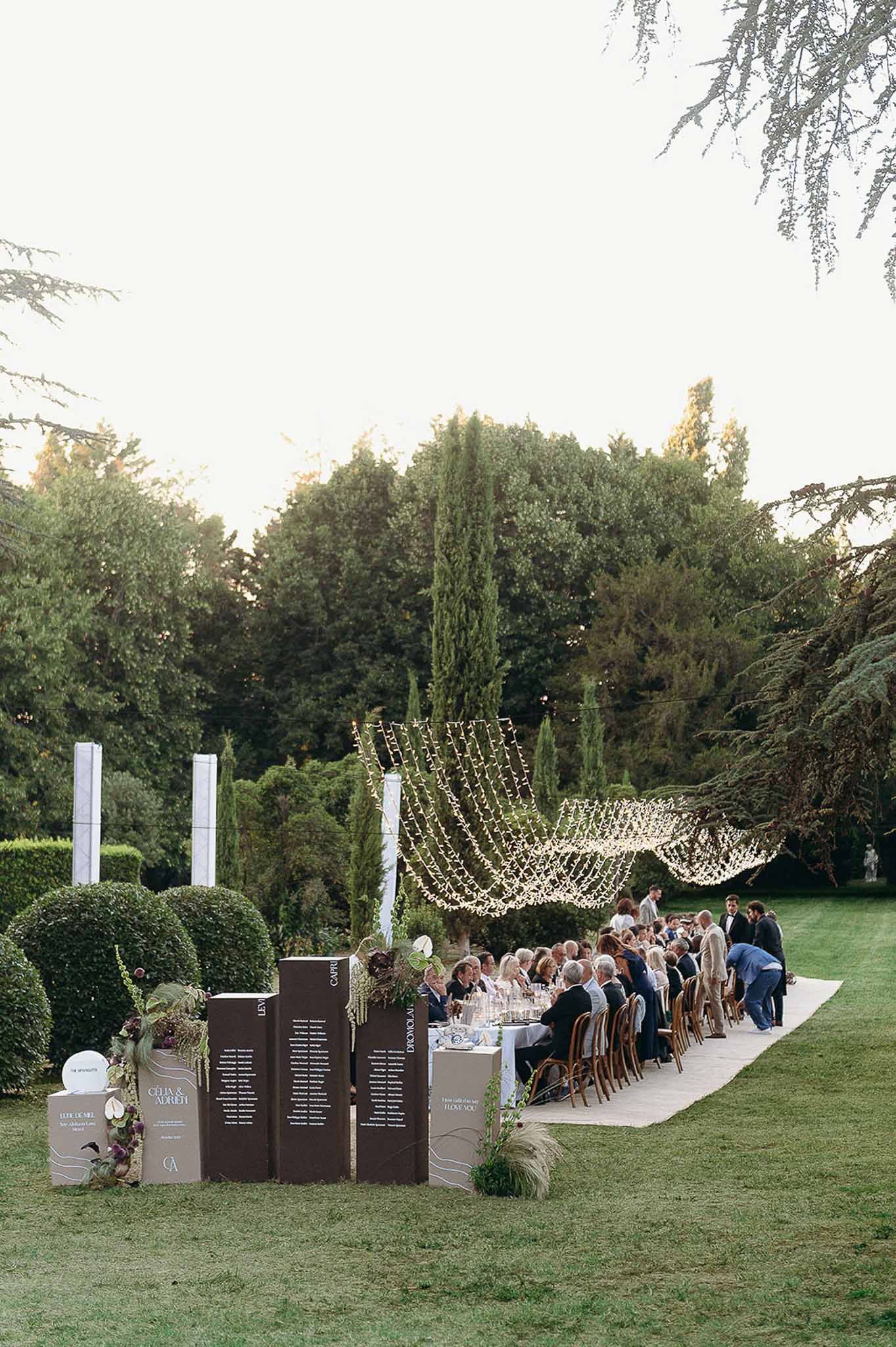 Table number arrangement with flower decor at the garden reception at Domaine de Perrotin