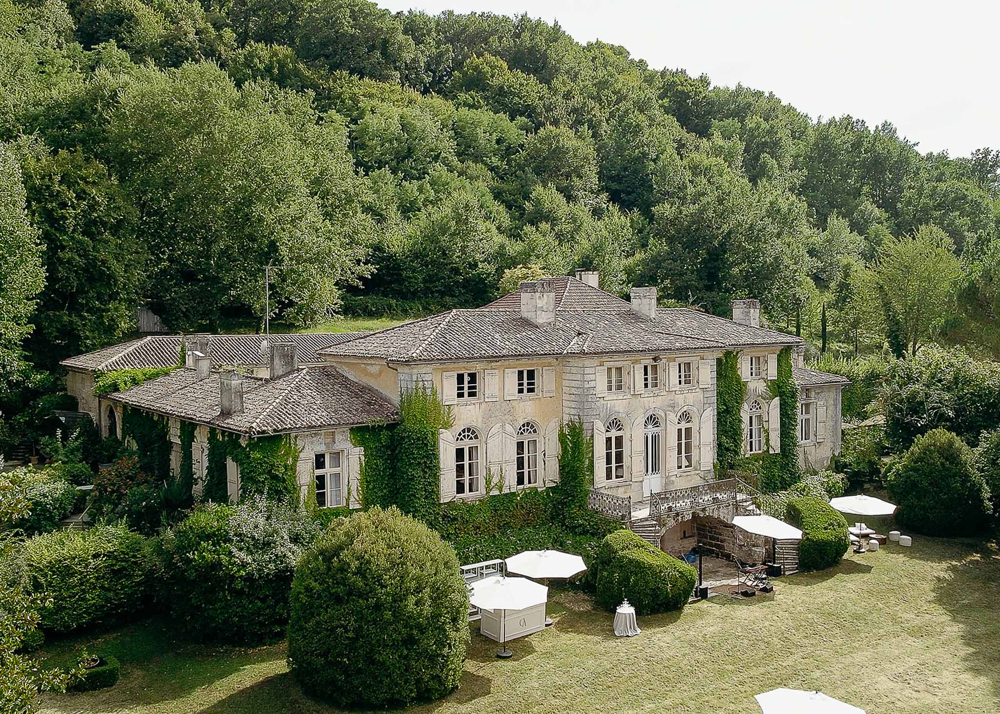 Chateau garden with plants and furniture at Domaine de Perrotin