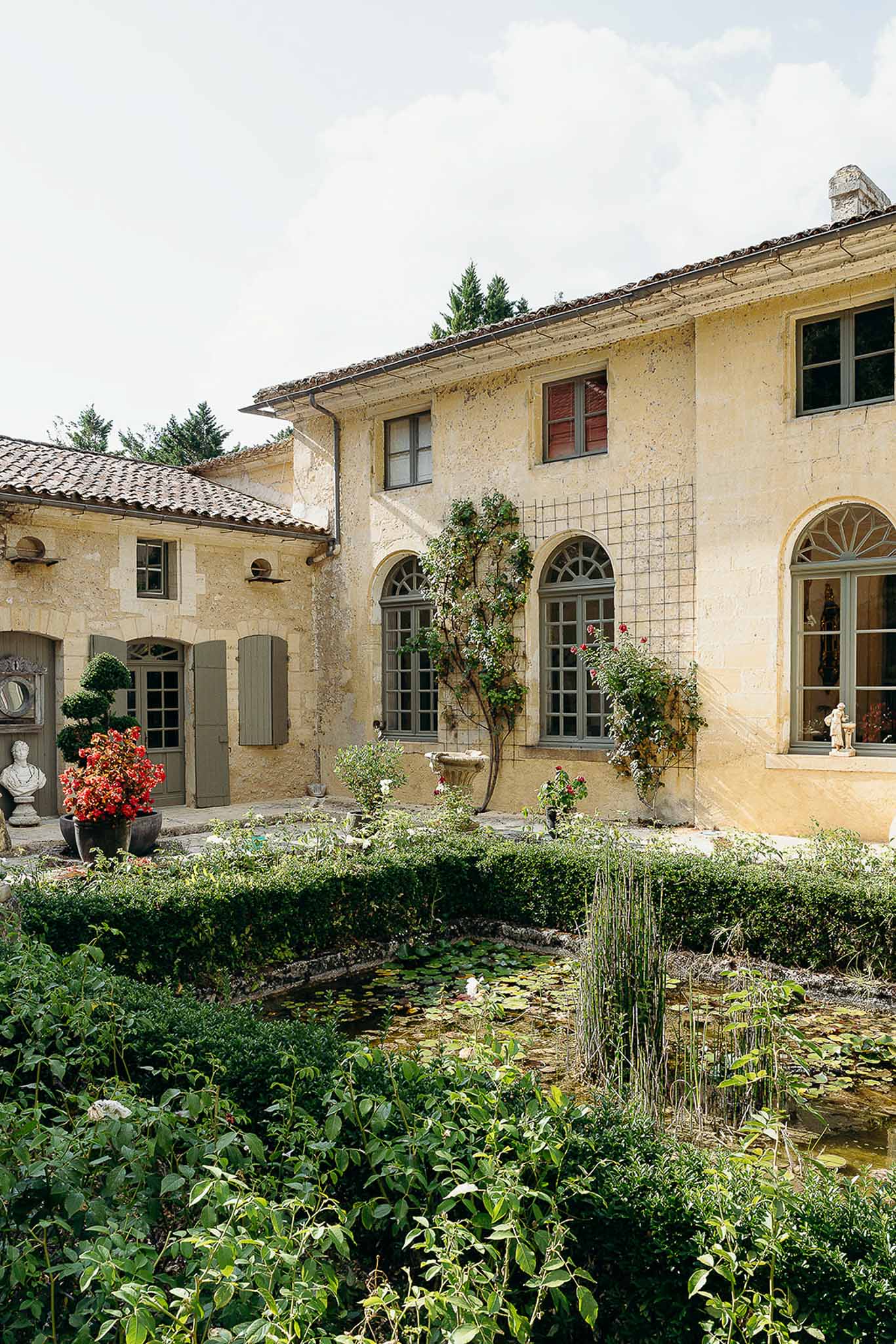 Pond and vintage luxury grounds at Domaine de Perrotin