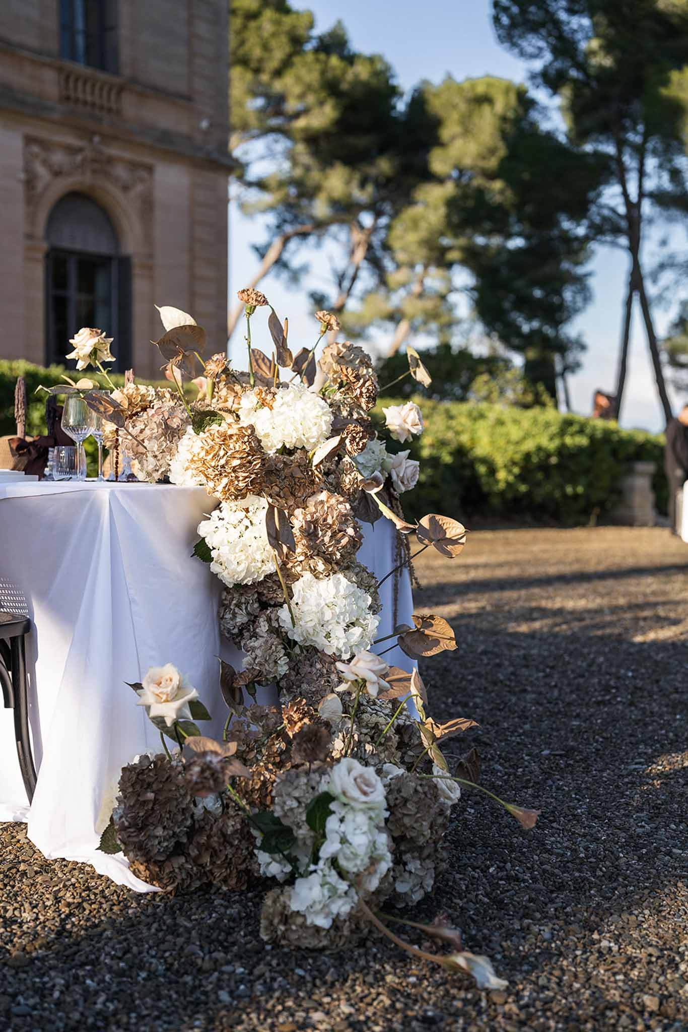 Dried floral table runner cascading from reception table at Chateau du Terral