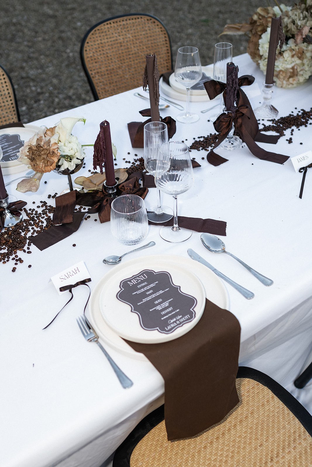 Place setting with chocolate napkin and printed menu card at Chateau du Terral