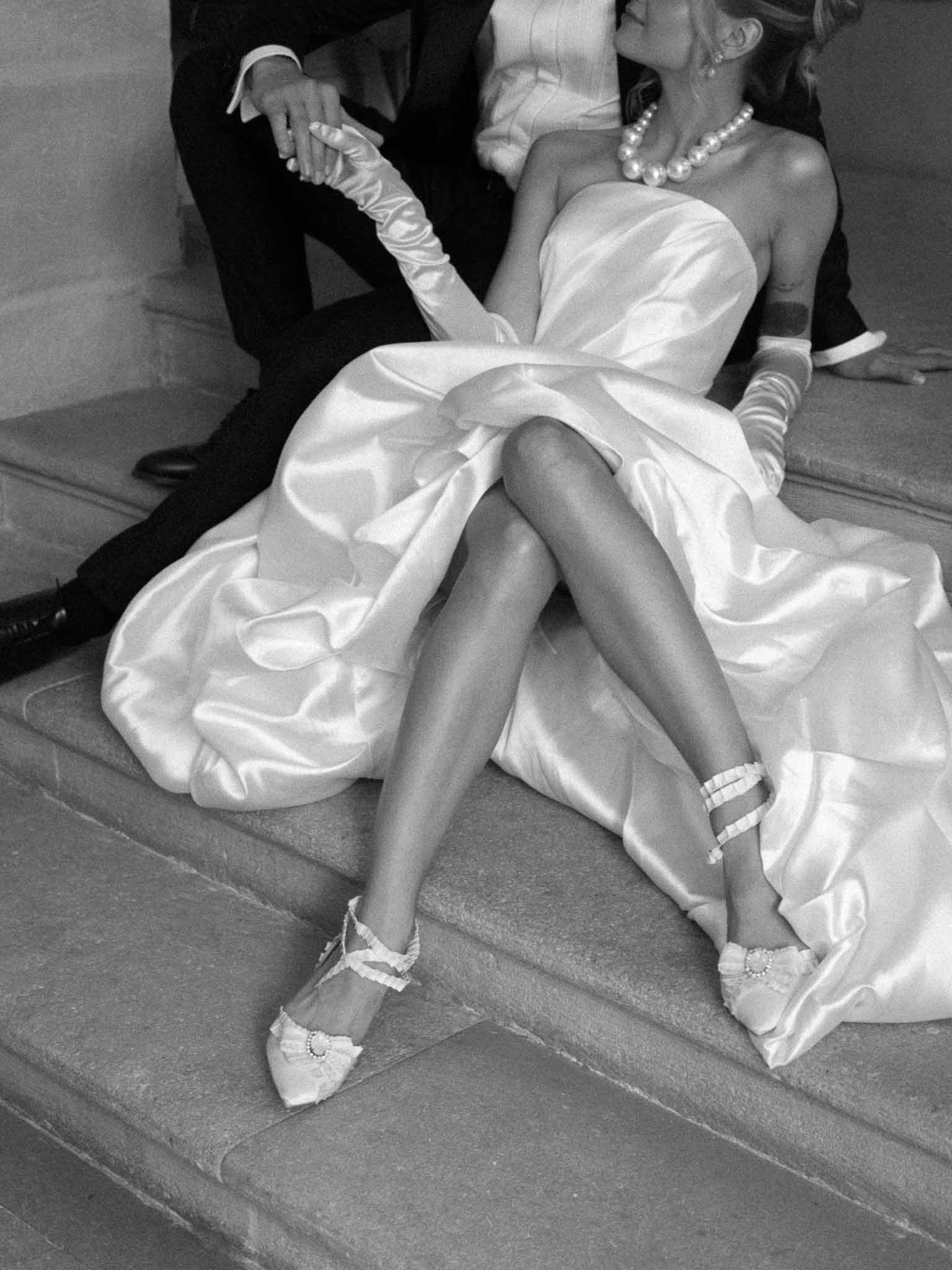 Full portrait of bride in satin strapless ball gown