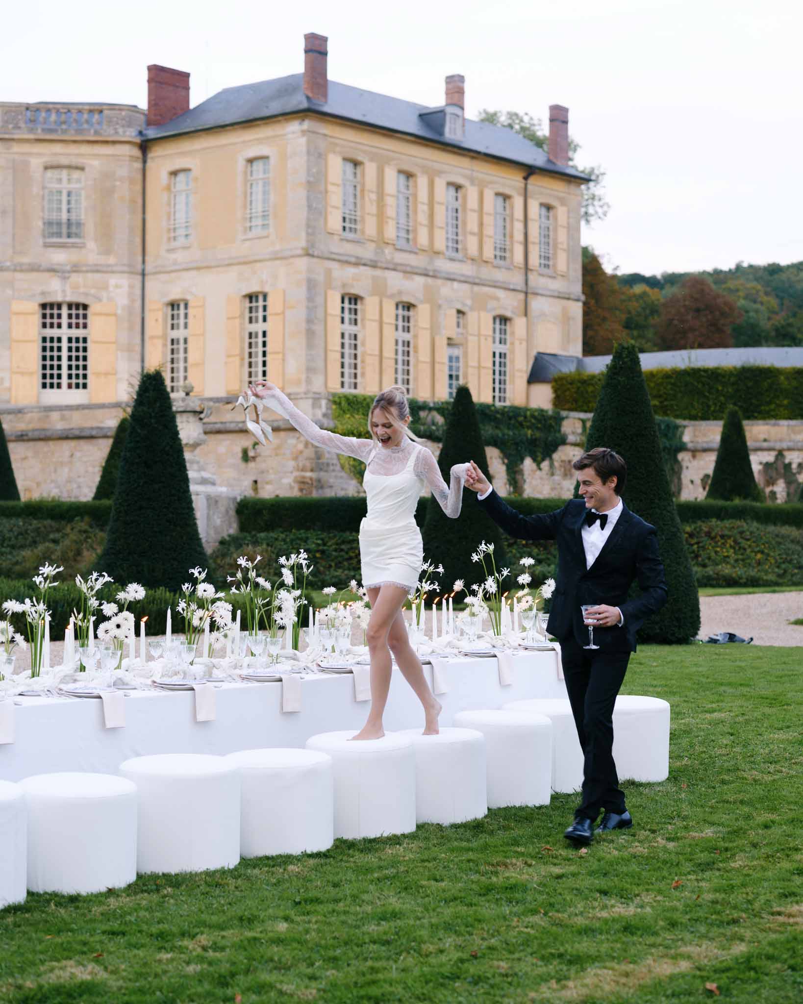 Bride walking in a short evening dress at the reception