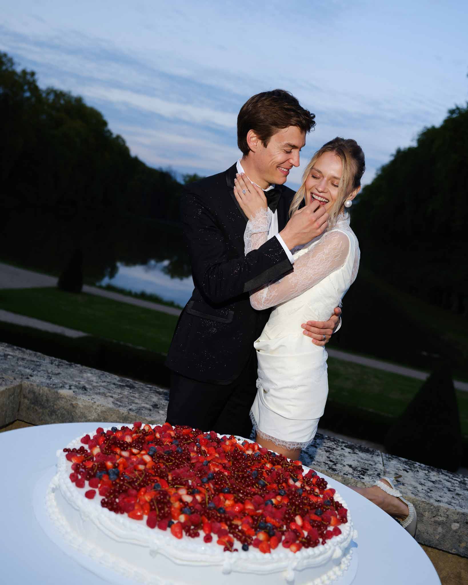 Couple sharing a strawberry shortcake at the reception