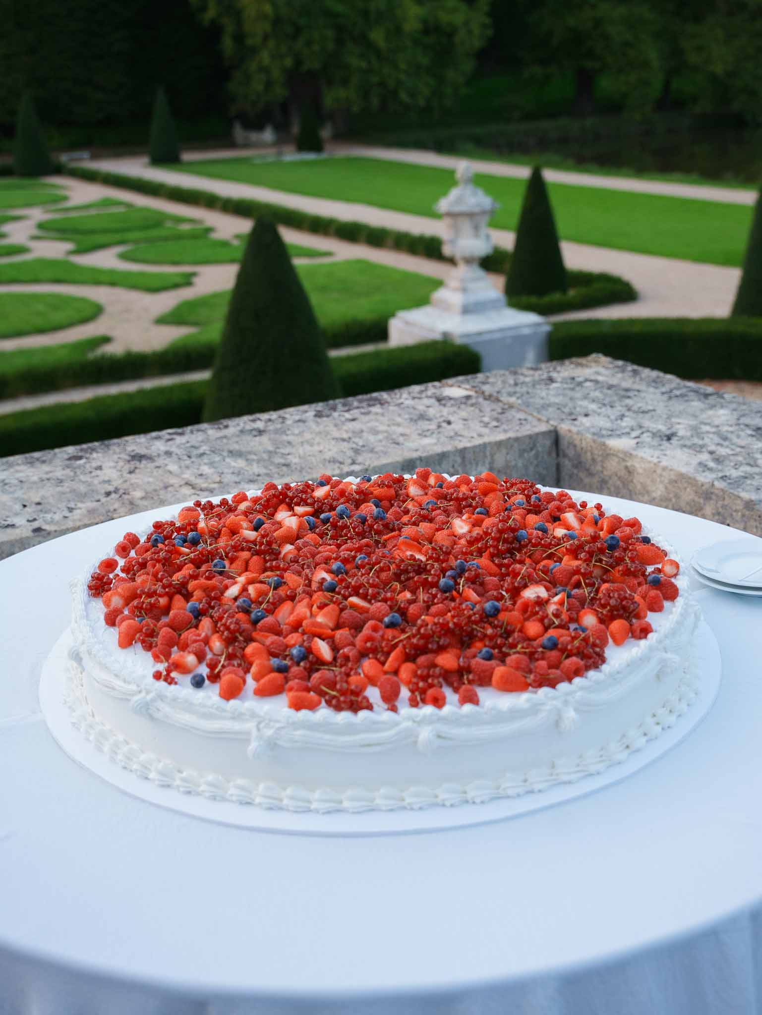 Multi-tier strawberry shortcake wedding cake on the reception table