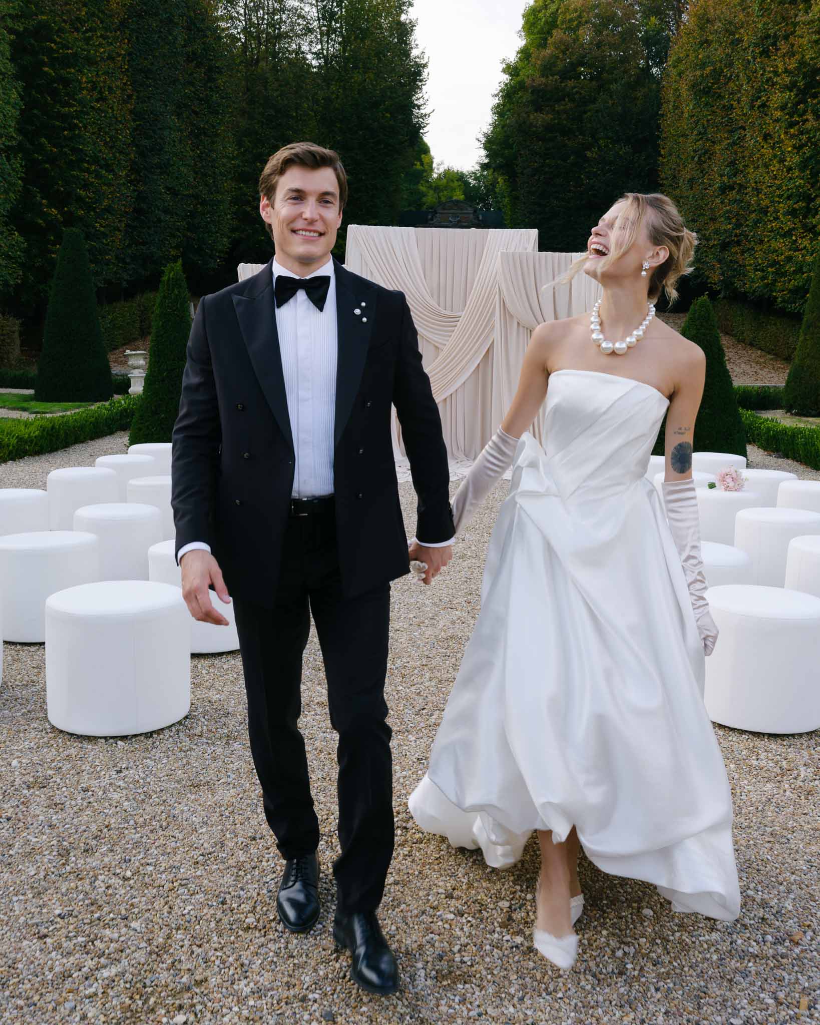 Couple walking back down the ceremony aisle hand in hand