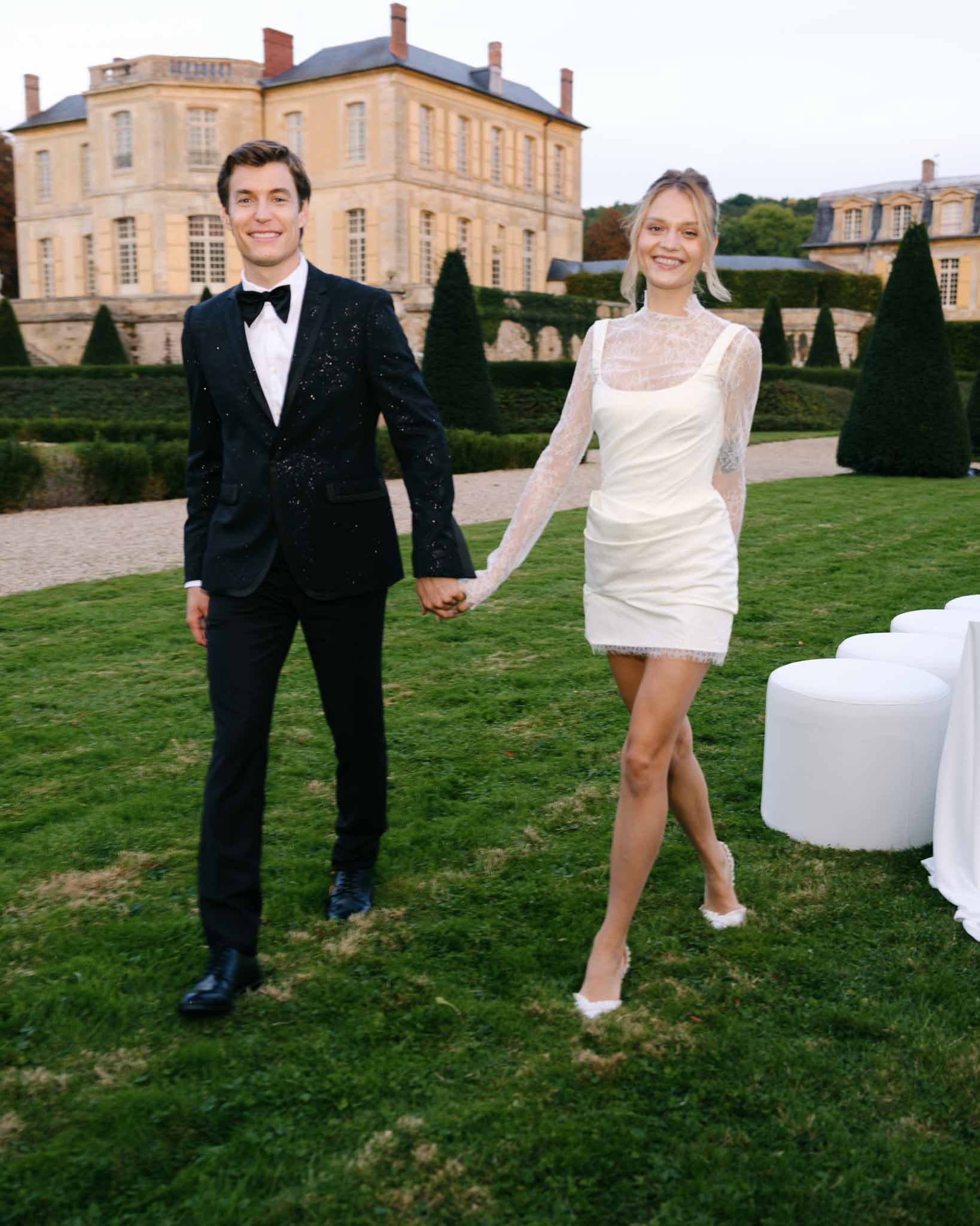 Couple walking hand in hand through the reception area