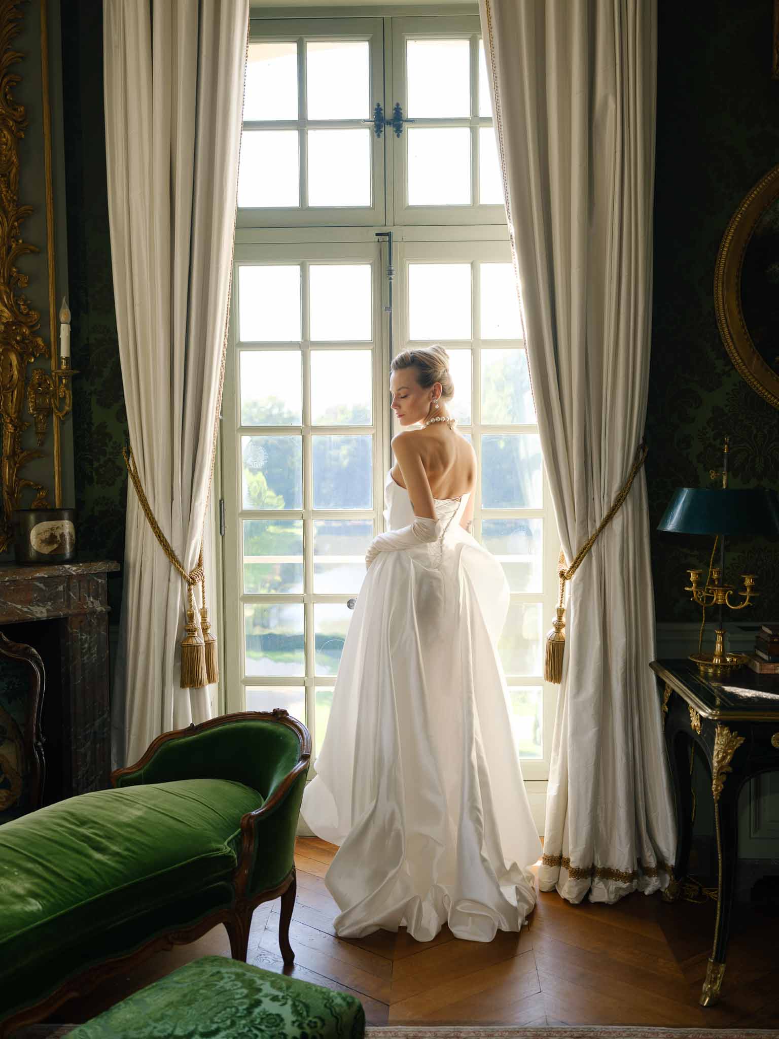 Detail of the back of bride's wedding dress showing buttons and fabric