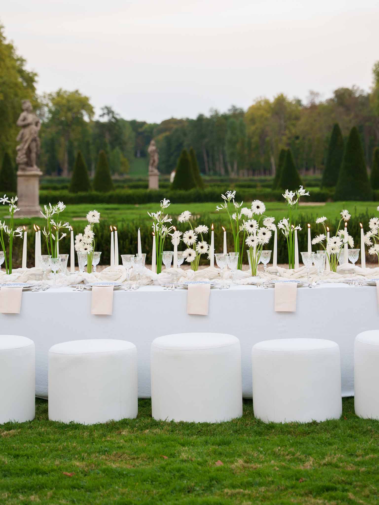 Reception table centerpiece with white flowers and blue accents